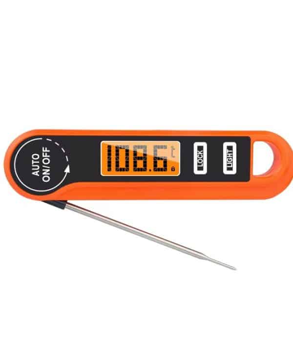 Digital thermometer displaying Fahrenheit and Celsius readings for meat cooking