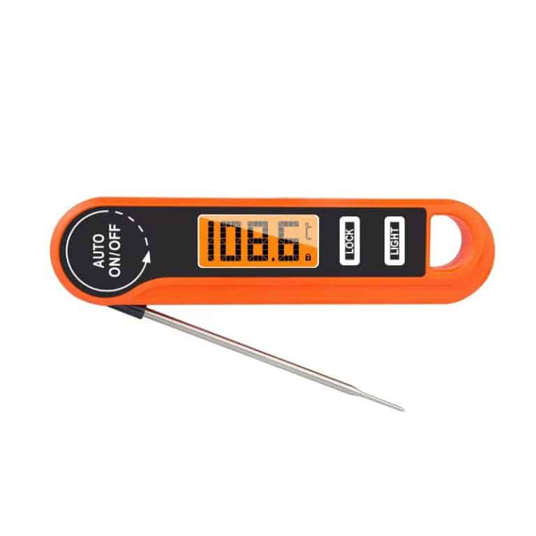 Digital thermometer displaying Fahrenheit and Celsius readings for meat cooking